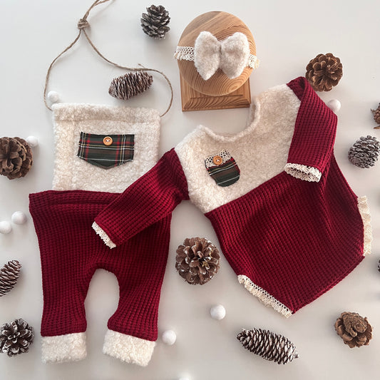 Holiday outfit for a boy and a girl in newborn size for a photo shoot.