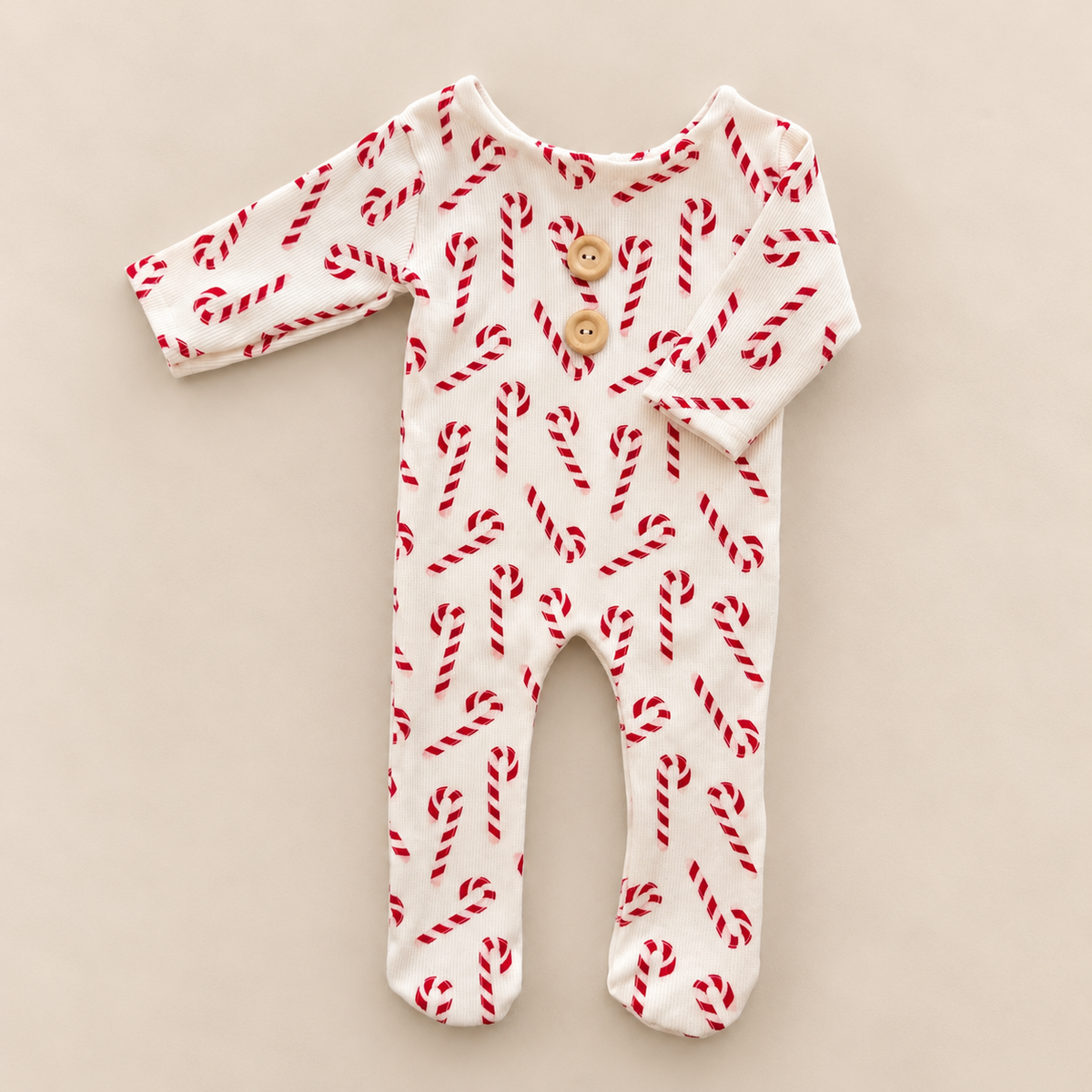 Christmas candy cane ivory footed newborn photography romper with red print, long sleeves and two front buttons
