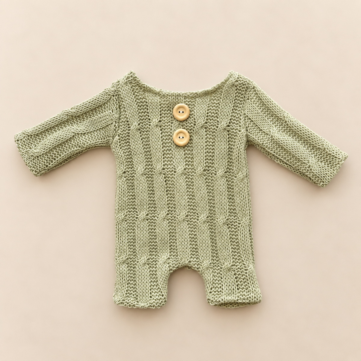 Pale sage green cable knit newborn photography romper with two front buttons and long sleeves