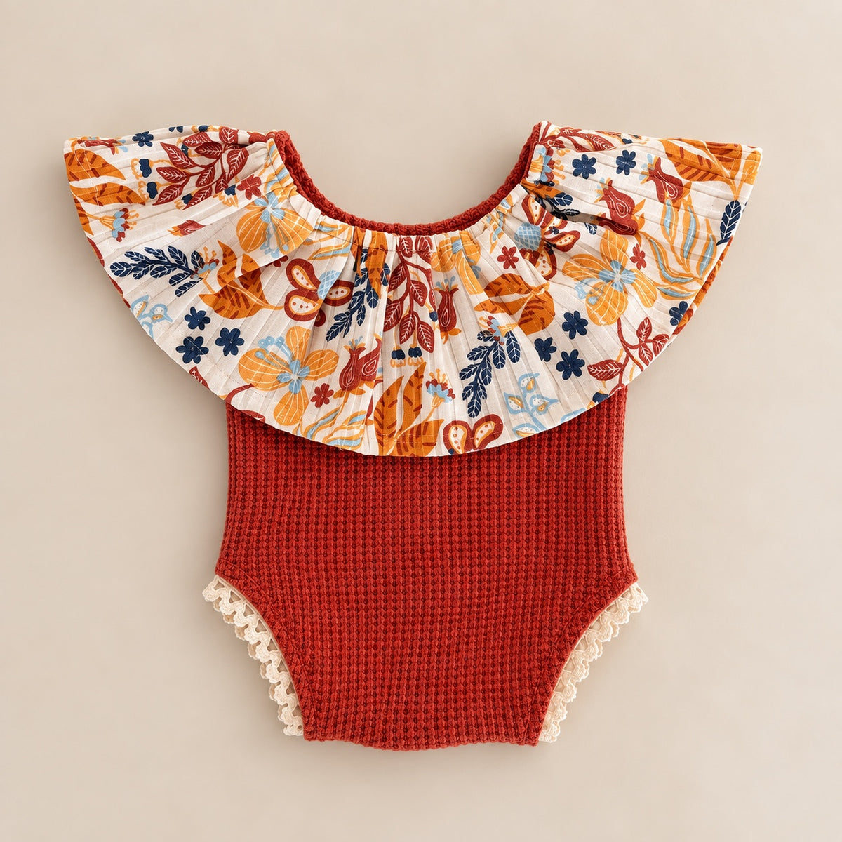Rust floral ruffle romper for newborn photography