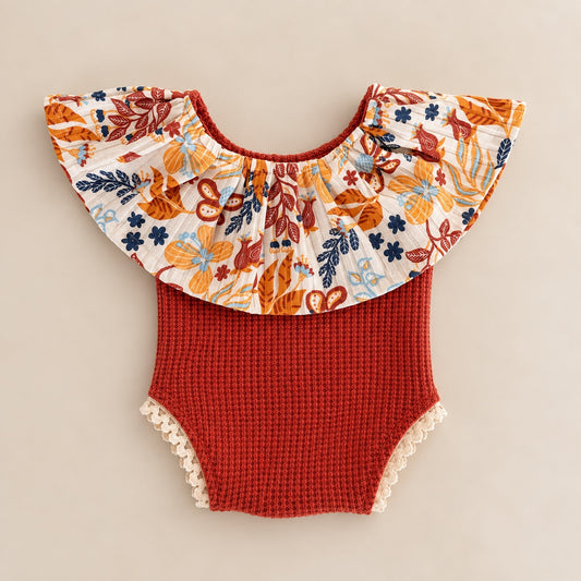 Rust floral ruffle romper for newborn photography