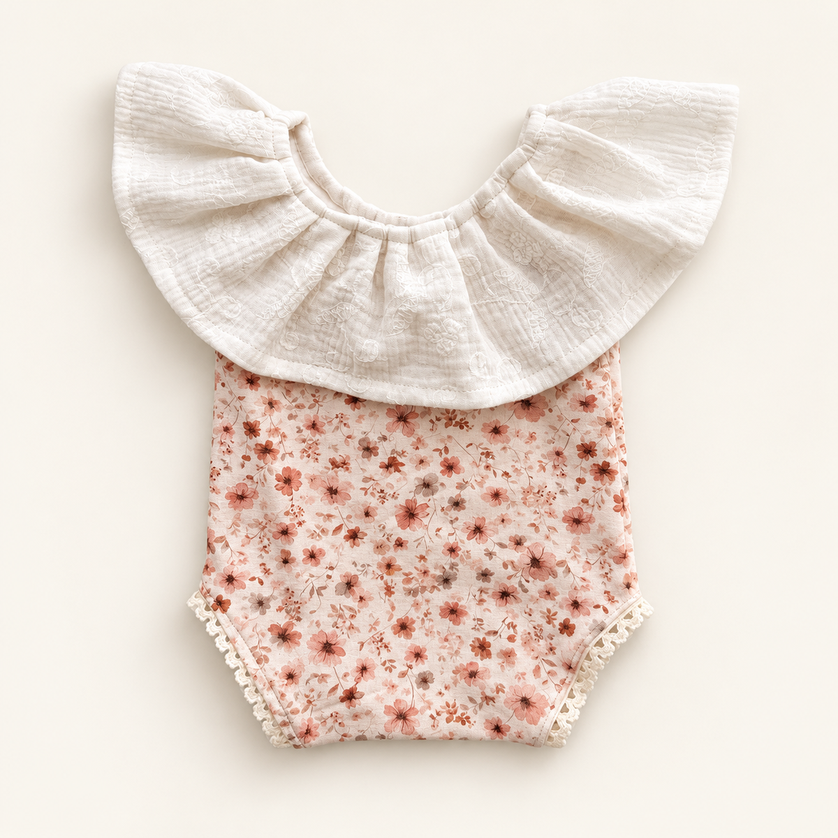 Blush pink floral newborn photography romper with oversized ivory embroidered muslin ruffle and cream lace trims
