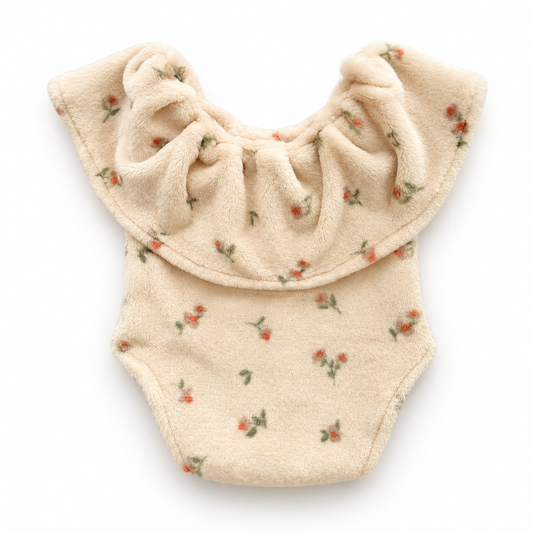 Cream floral plush ruffle romper for newborn photography with tiny coral flowers and oversized collar