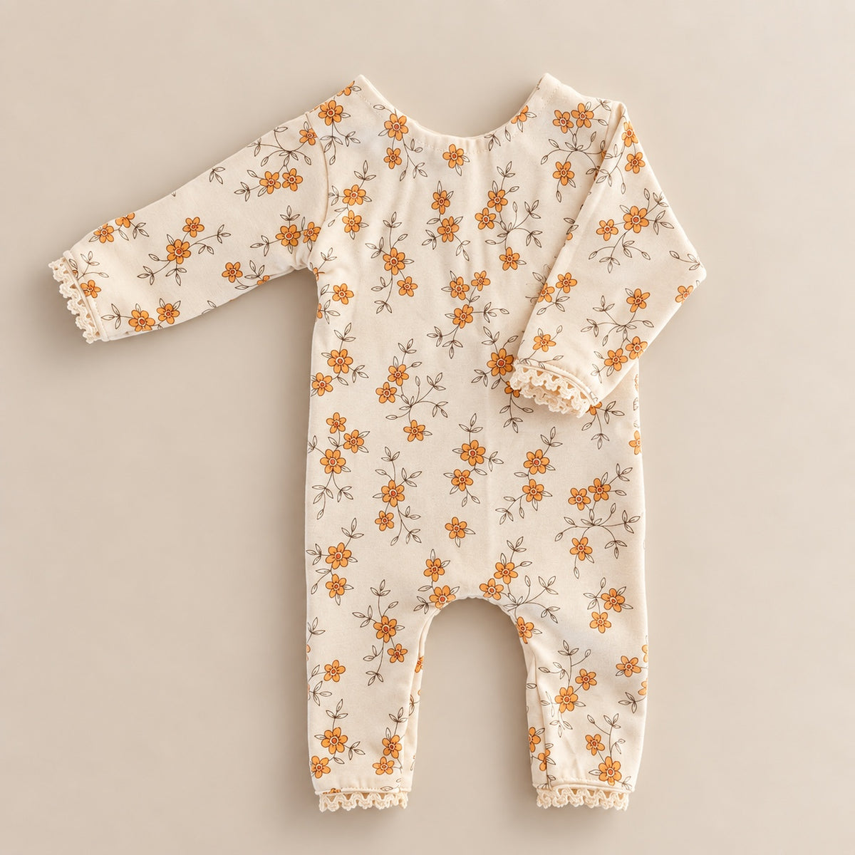 Cream floral long sleeve romper with orange flowers and lace trim for newborn photography