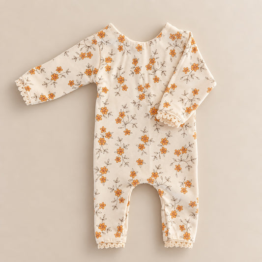 Cream floral long sleeve romper with orange flowers and lace trim for newborn photography