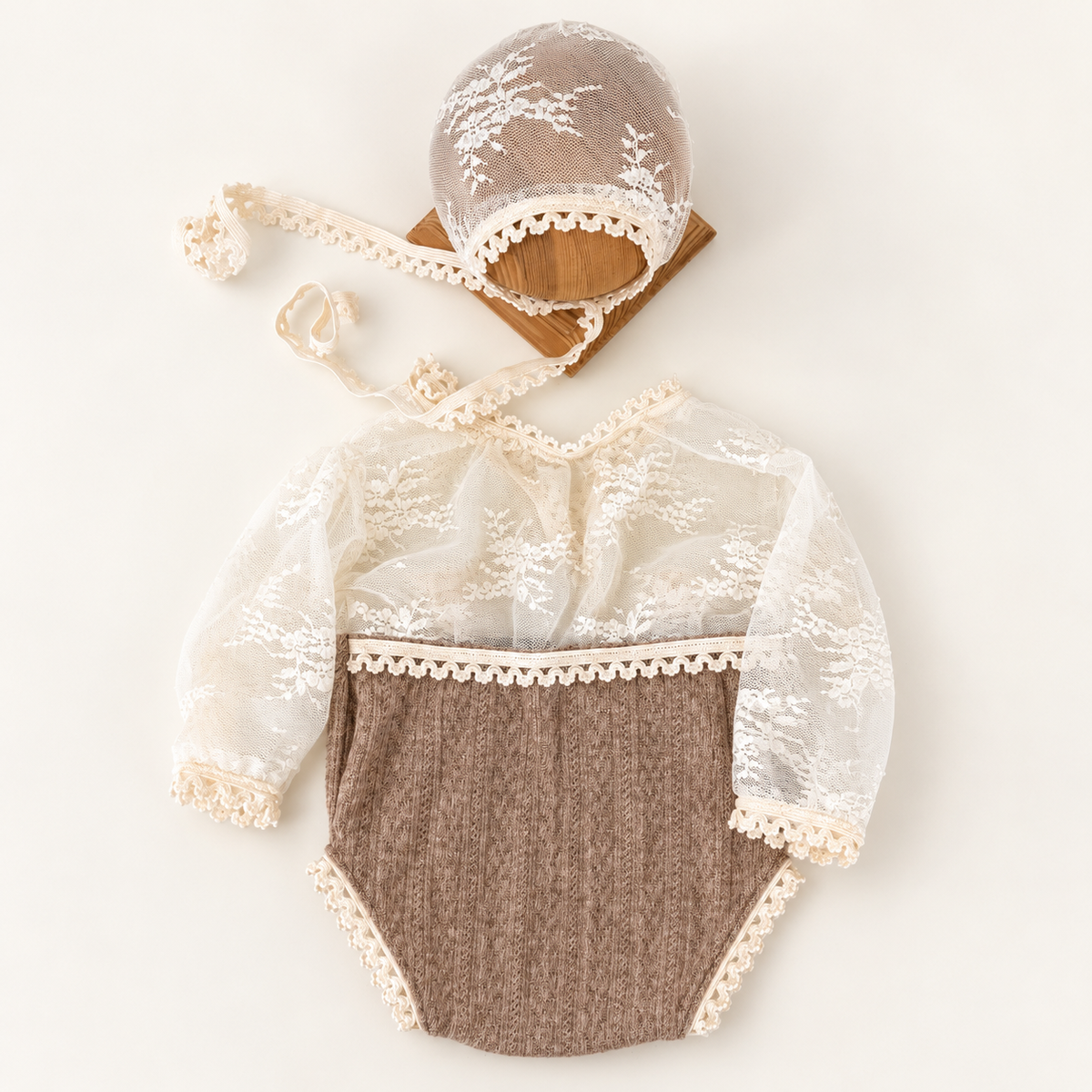 Hazel Heirloom Lace newborn romper with ivory floral lace sleeves, taupe knit bottom and matching bonnet