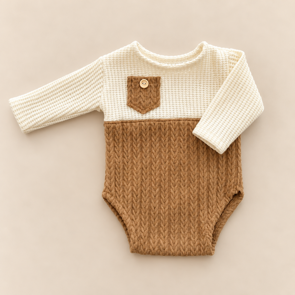 Ivory and camel brown long sleeve newborn photography romper with waffle and cable knit textures and small front pocket