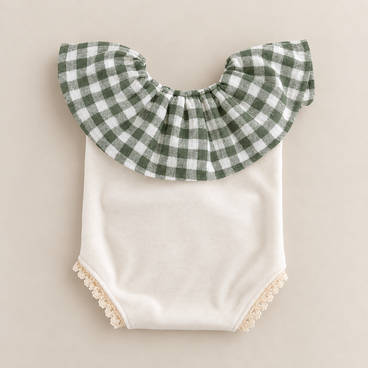 Ivory newborn photography romper with sage green gingham ruffle collar and cream lace trim