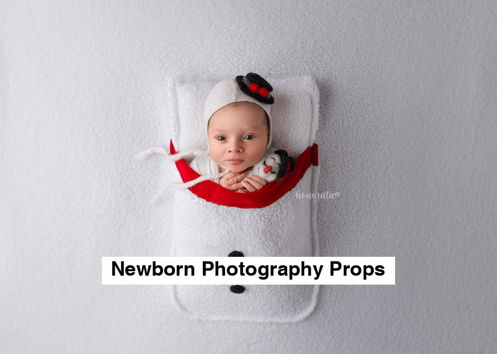 Snowman Backdrop with a pocket and snowman's hat. Newborn photo props featuring a baby in a snowman-themed setup.